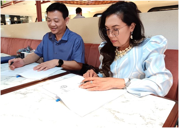 Dr Ras Adiba Mohd Radzi signing